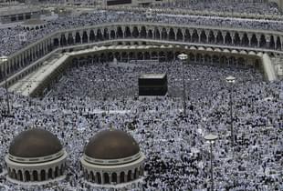 Muslim pilgrims pray the evening prayer inside the Grand Mosque and Holy Kabba, the holiest places for Muslims around the world  (Muhannad Fala’ah/Getty Images)